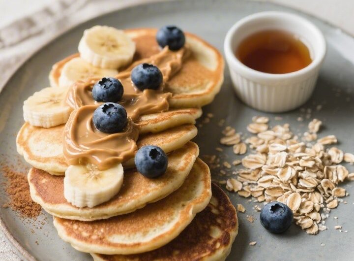Final dish presentation: Restaurant-quality plating of banana oat pancakes in a neat fan on a matte
