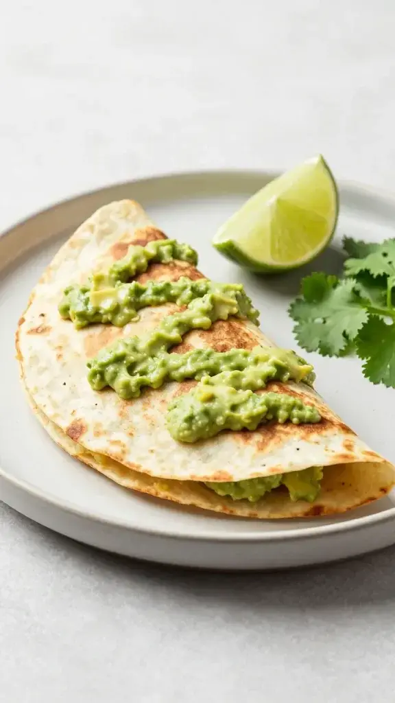 Serving moment: Serving moment with a half-assembled quesadilla on a plate, drizzle of avocado crema, a lime wedge and fresh cilantro sprigs, inviting texture and color, bright studio-like setting.